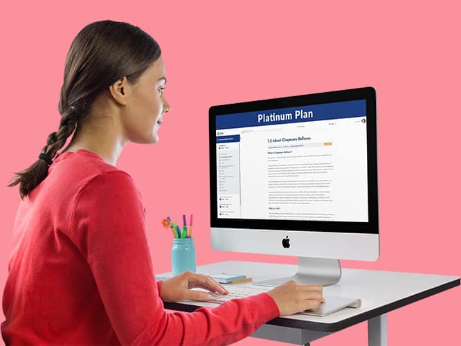 woman looking at Apple mac desktop computer
