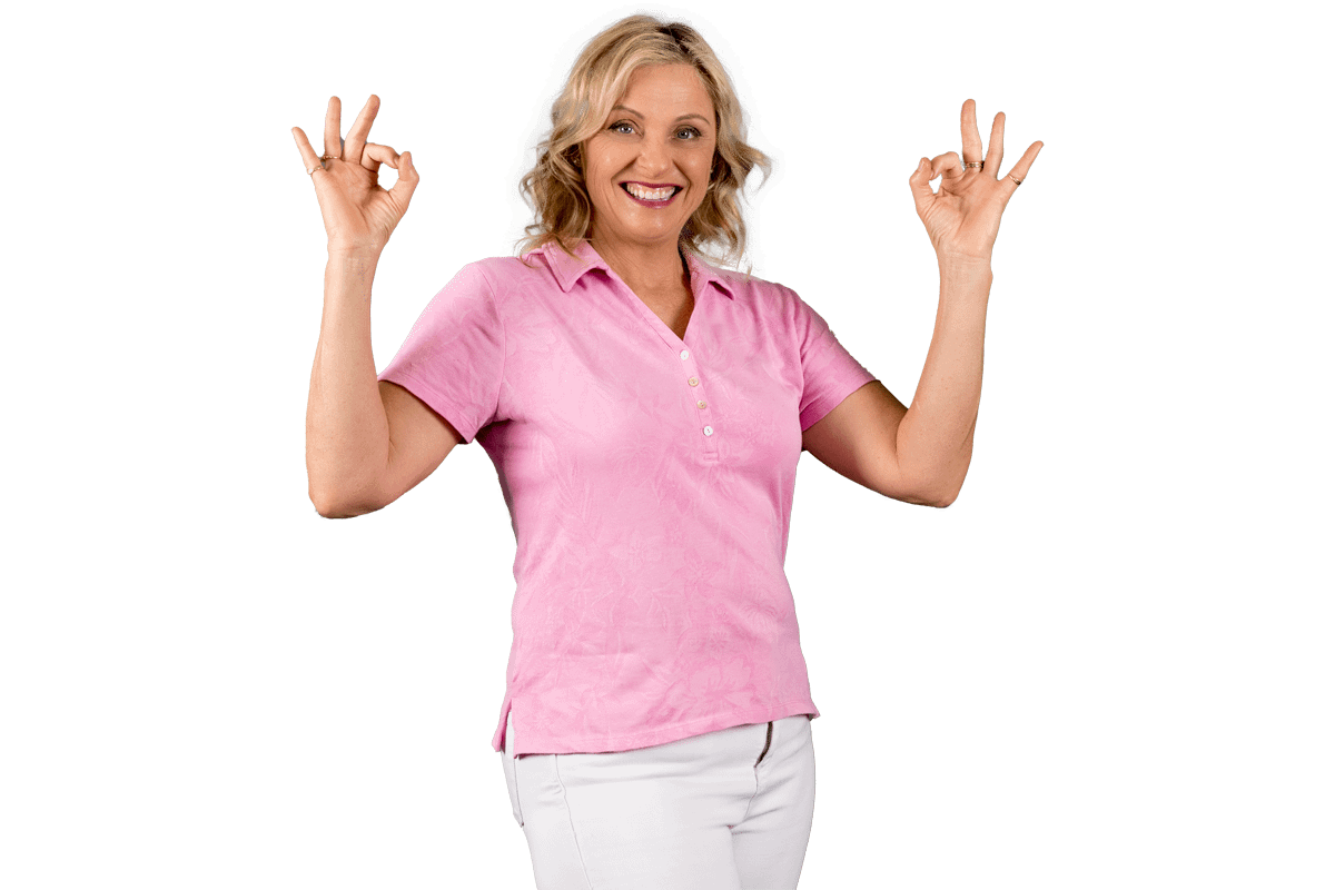 Paula Nutting, your musculoskeletal specialist, wearing a pink blouse and white pants smiling with two okay hand signs pose